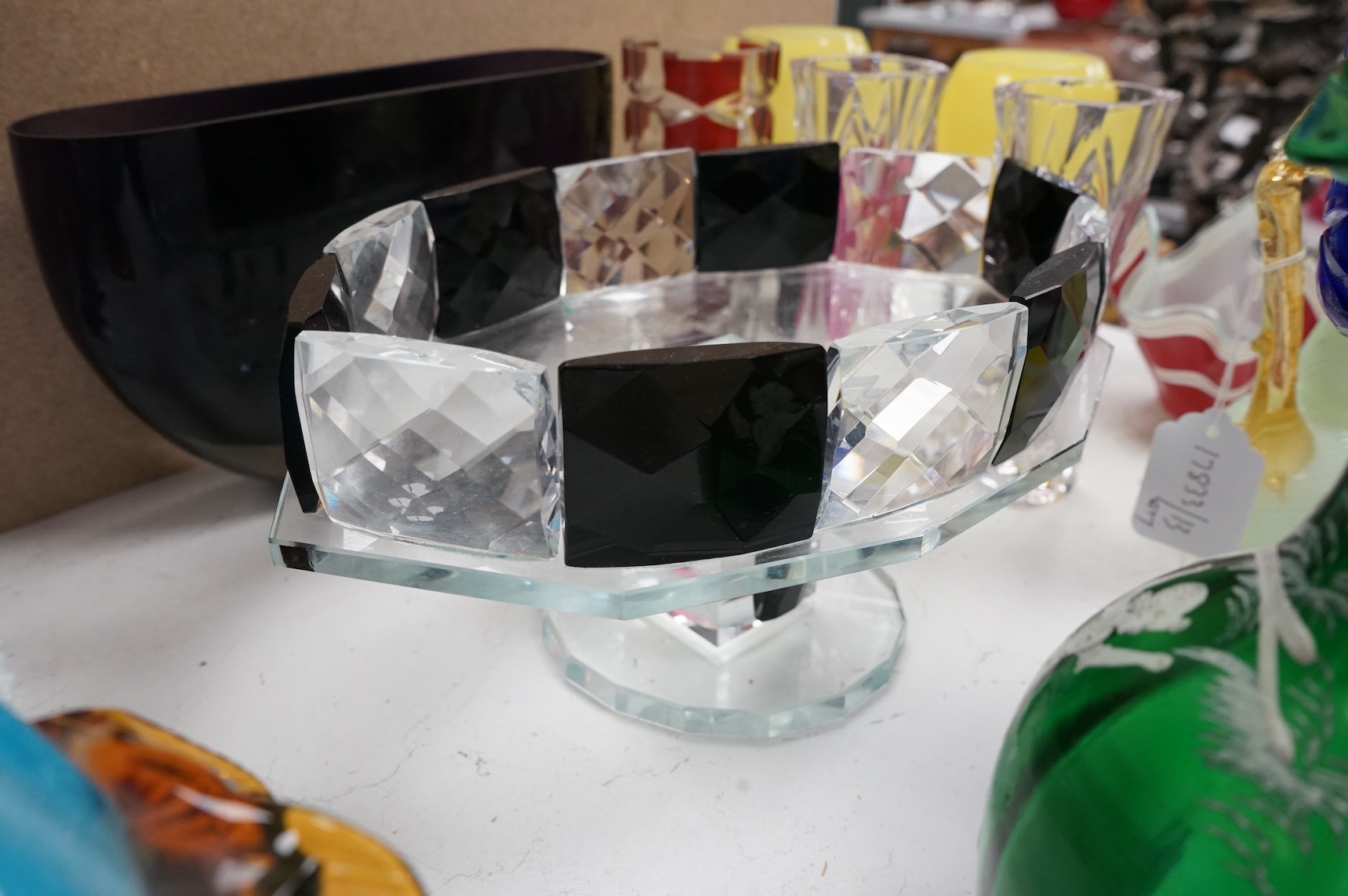 Mixed glassware to include a green Mary Gregory jug, a 'vaseline' glass ewer, an Art Deco style clear and black glass fruit tazza, etc.